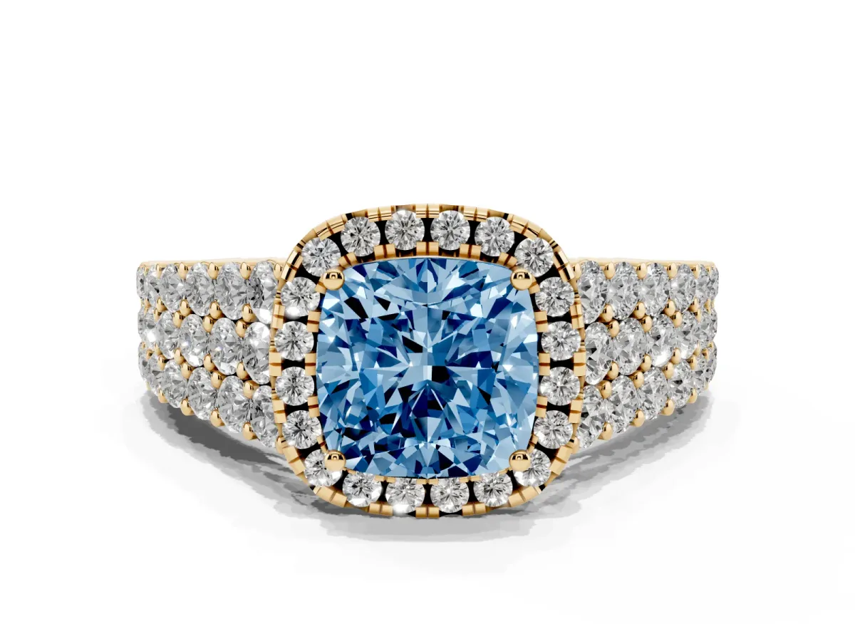 Fancy Blue Cushion Cut Diamond Halo Engagement Ring with Triple Row Round Pavé Band and Prong Setting Yellow gold