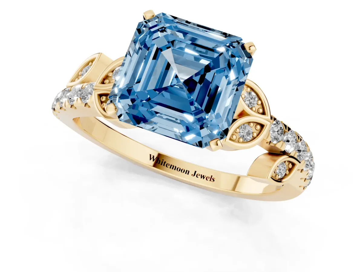 Fancy Blue Asscher Cut Solitaire Leaf-Inspired Diamond Ring with Pavé Band and Four-Prong Setting Yellow gold