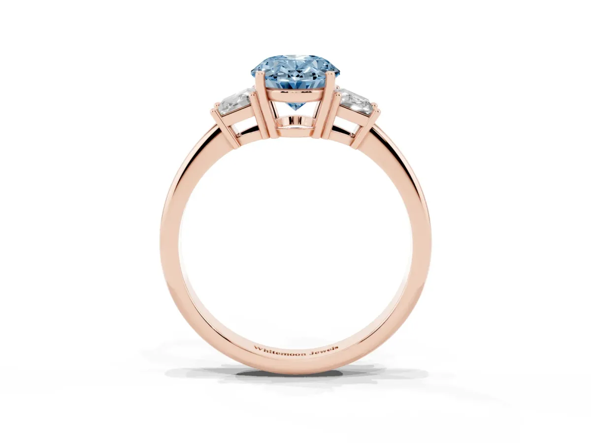 Fancy Blue Oval Cut Diamond Three-Stone Ring with Trapezoid Side Stones and Prong Setting Rose gold