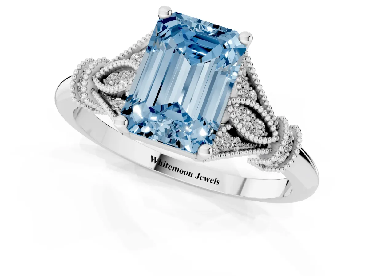 Fancy Blue Emerald Cut Diamond Solitaire Ring with Floral Filigree and Pave Accents White gold