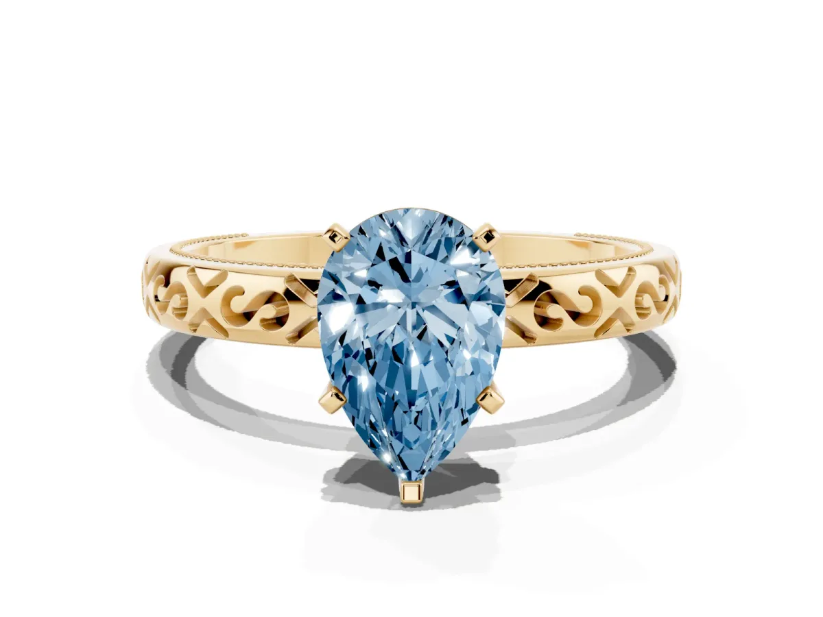 Fancy Blue Pear Cut Solitaire Engagement Ring with Scrollwork Band and Four-Prong Setting Yellow gold
