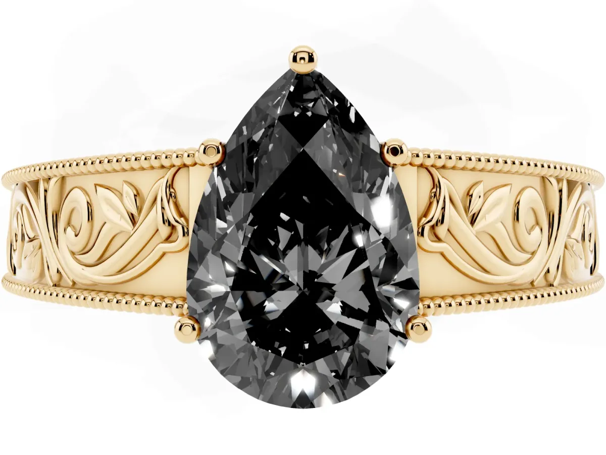 Fancy Black Pear Cut Diamond Solitaire Ring with Engraved Band and Four-Prong Setting Yellow gold