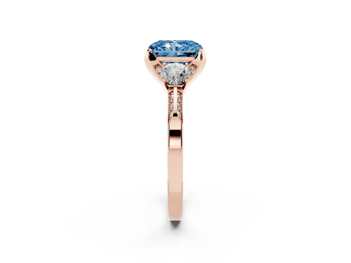 Fancy Blue Radiant Cut Brilliant Three-Stone Diamond Ring with Pavé Band and Four-Prong Setting Rose gold