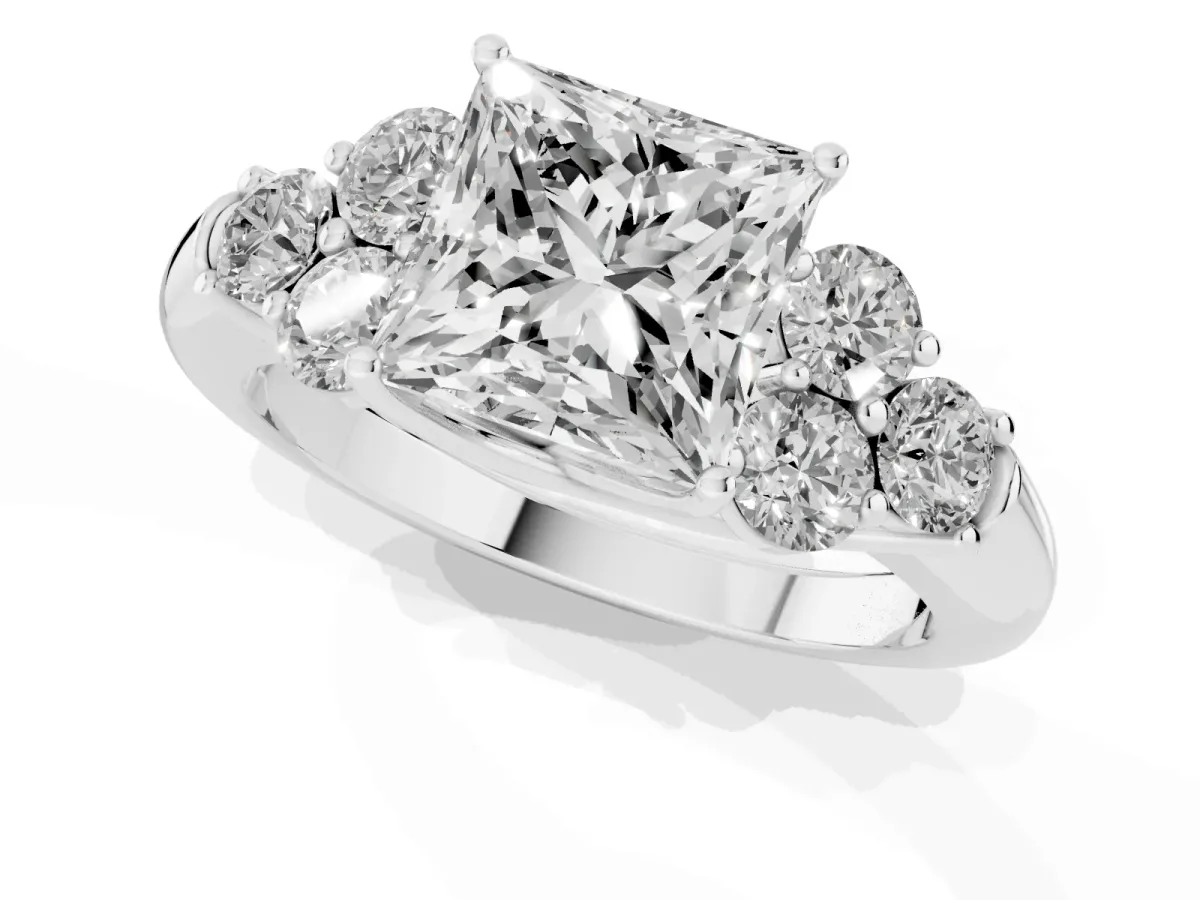 Princess Cut Cut Diamond Cluster Ring with Round Accent Stones and Prong Setting on a Classic Band White gold