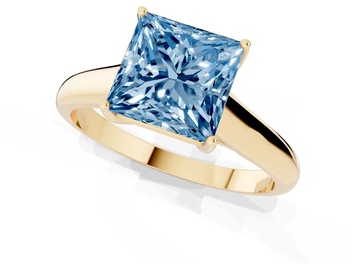 Fancy Blue Princess Cut Solitaire Engagement Ring with Tapered Band and Four-Prong Setting Yellow gold
