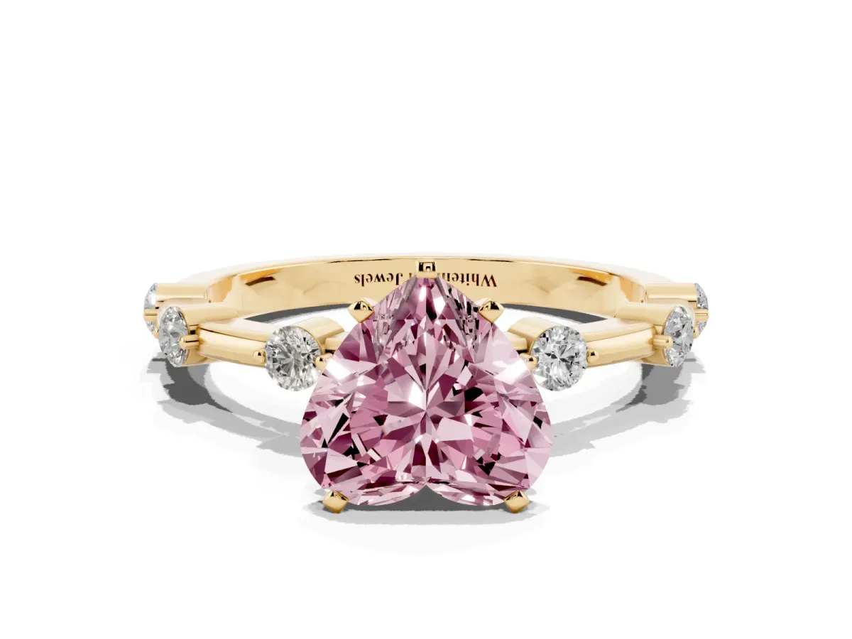 Fancy Pink Heart Cut Solitaire Diamond Ring with Bezel Set Side Stones and Prong Setting Yellow gold
