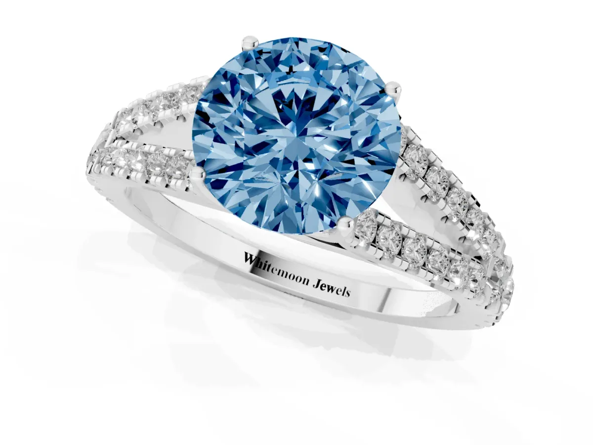 Fancy Blue Round Cut Diamond Split Shank Engagement Ring with Round Pavé and Prong Setting Silver