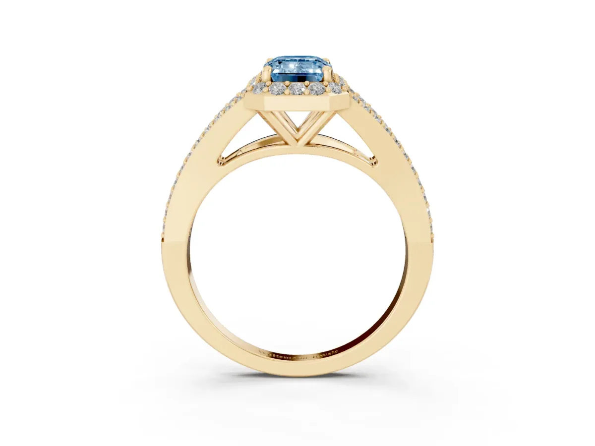 Fancy Blue Emerald Cut Halo Split Shank Pave Diamond Ring with Four-Prong Setting Yellow gold