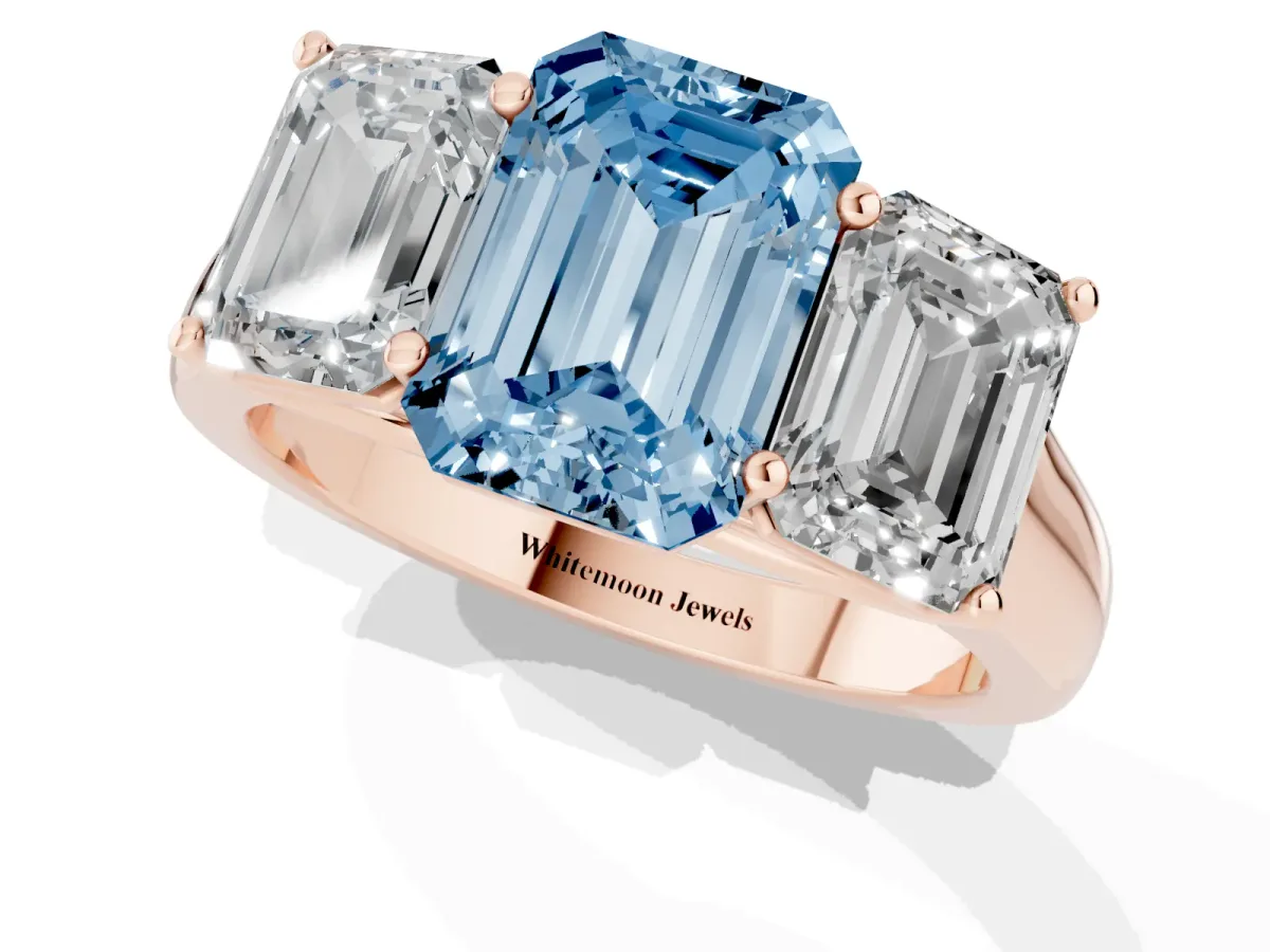 Fancy Blue Emerald Cut Three-Stone Diamond Ring with Prong Setting on a Classic Band Rose gold