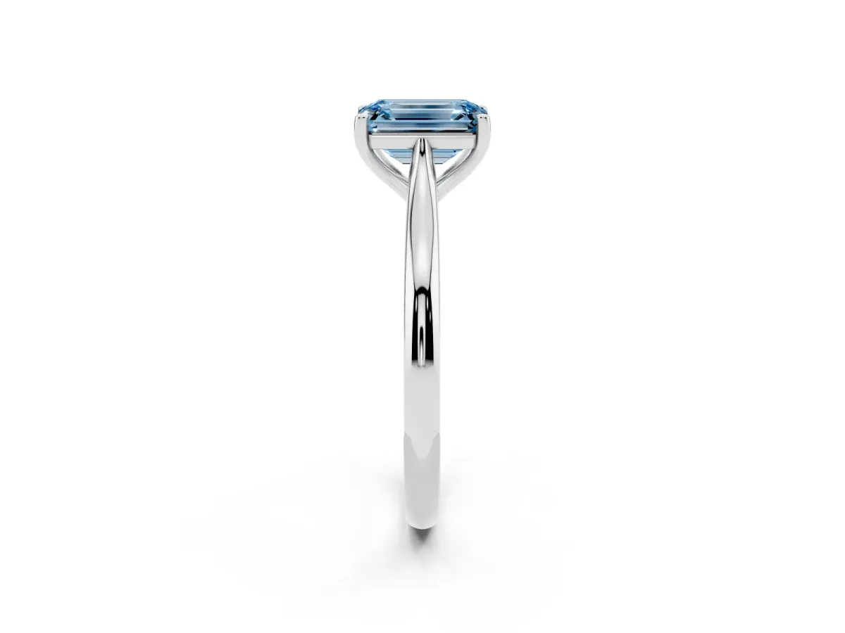 Fancy Blue Emerald Cut Cut Solitaire Ring with Cathedral Band and Four-Prong Setting Silver