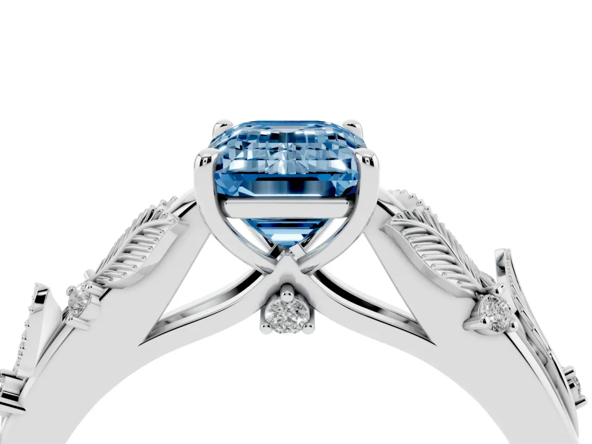 Fancy Blue Emerald Cut Diamond Solitaire Ring with Leaf Motif Band and Four-Prong Setting Silver