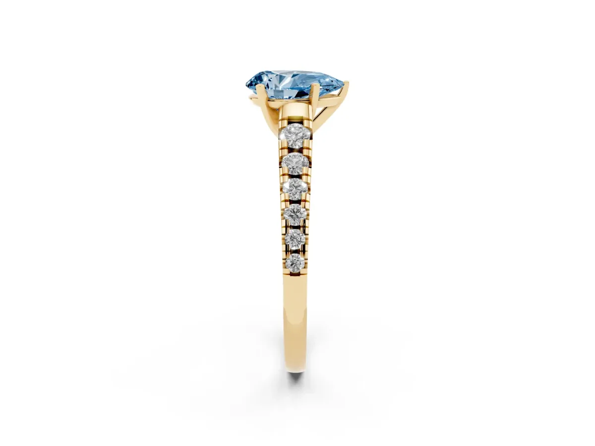 Fancy Blue Pear Cut Diamond Cathedral Solitaire Ring with Round Pavé Band Yellow gold
