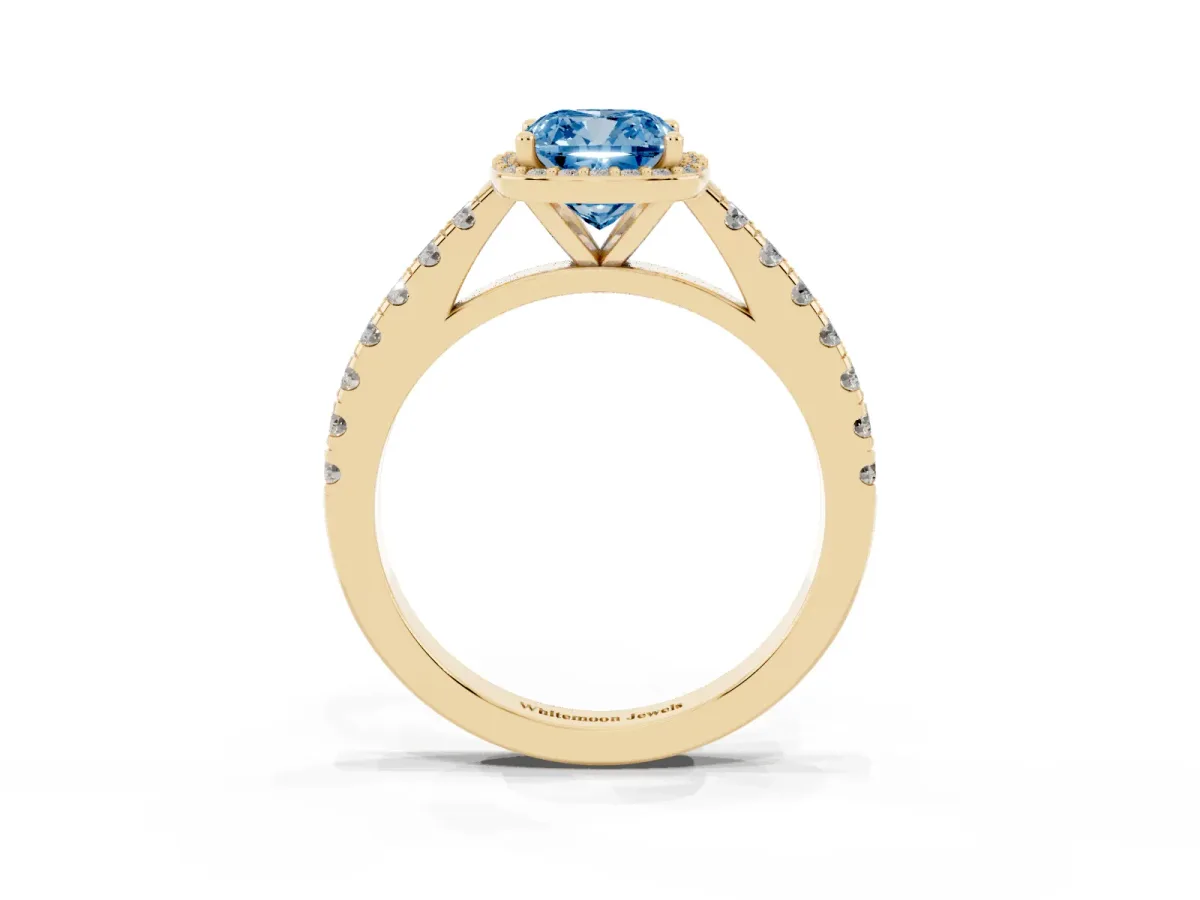 Fancy Blue Cushion Cut Cut Halo Diamond Engagement Ring with Pave Band and Four-Prong Setting Yellow gold