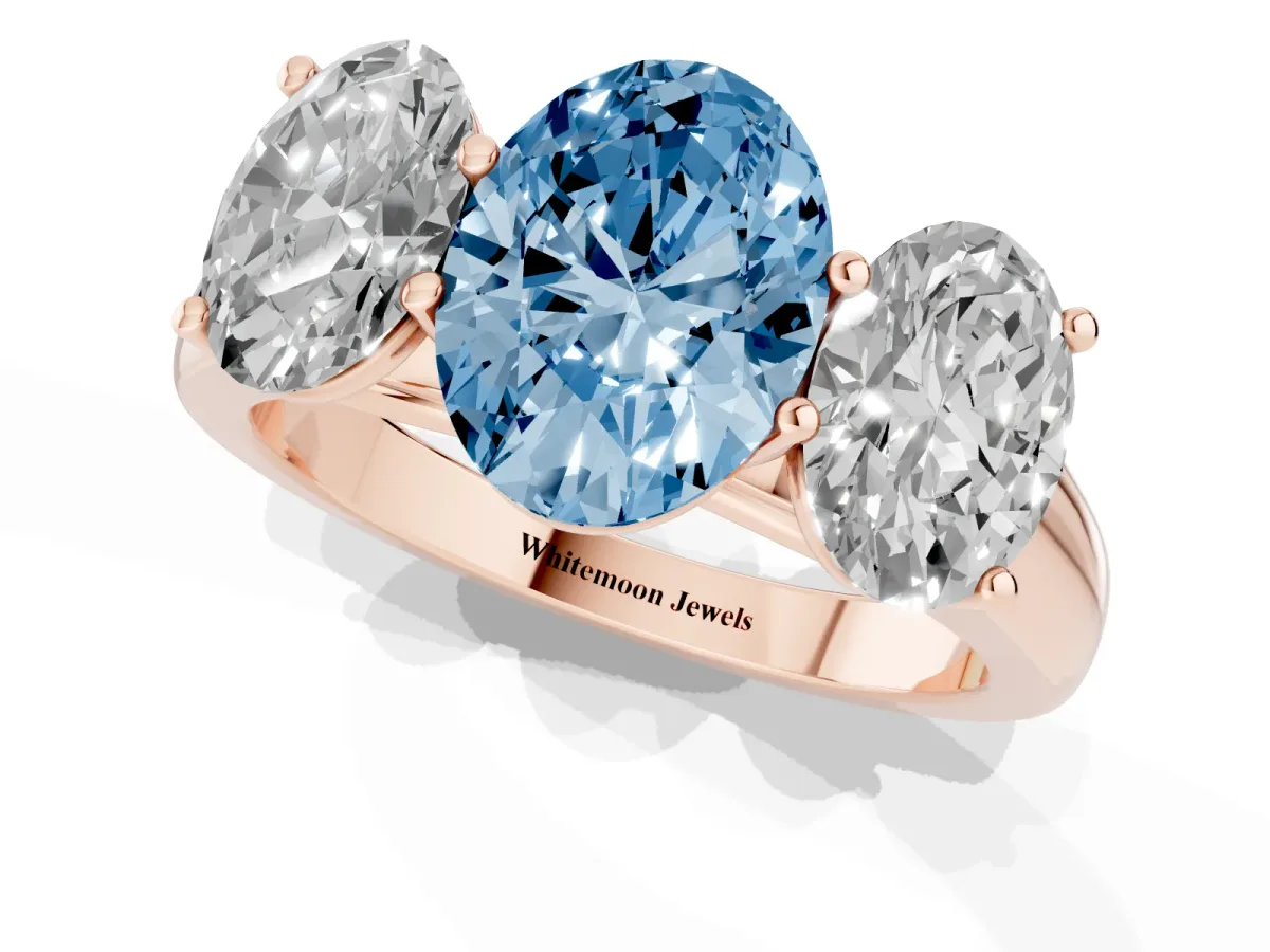 Fancy Blue Oval Cut Three-Stone Diamond Ring with Prong Setting on a Classic Band Rose gold