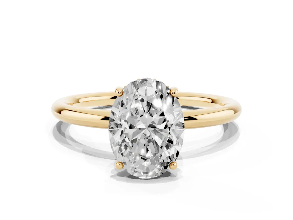 Oval Cut Solitaire Diamond Ring with a Classic Band and Four-Prong Setting Yellow gold