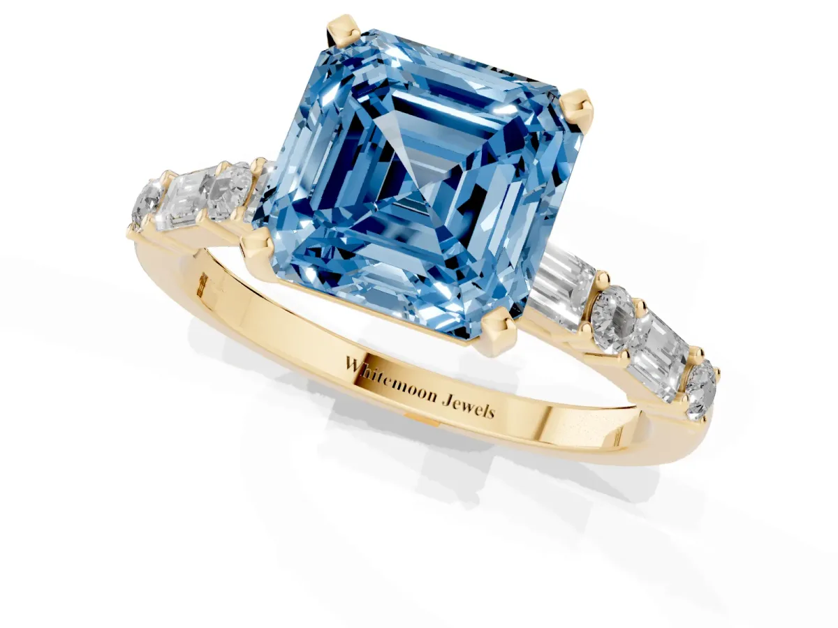 Fancy Blue Asscher Cut Diamond Solitaire with Side Baguettes and Channel Set Band Yellow gold