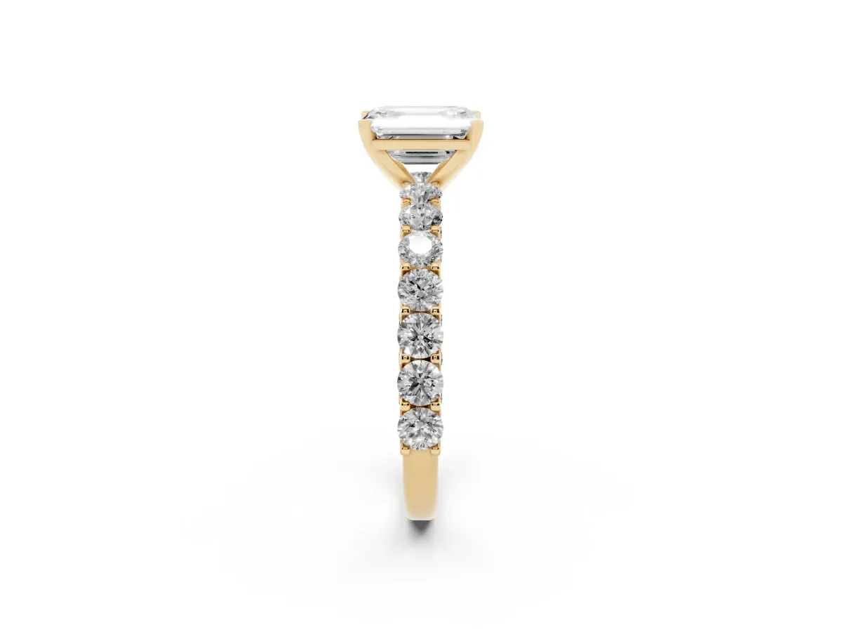 Emerald Cut Diamond Solitaire Ring with Shared Prong Pavé Band and Four-Prong Setting Yellow gold