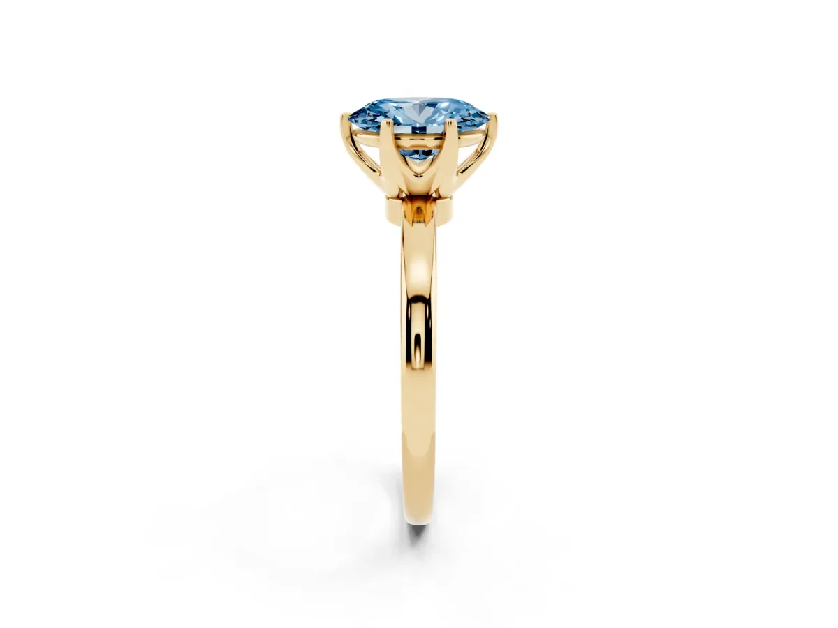 Fancy Blue Oval Cut Solitaire Diamond Ring with Six-Prong Setting on a Classic Band Yellow gold