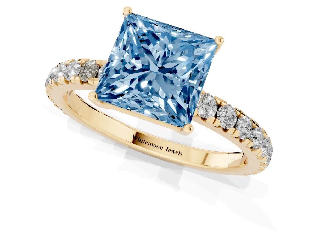 Fancy Blue Princess Cut Diamond Pavé Solitaire Engagement Ring with Four-Prong Setting Yellow gold
