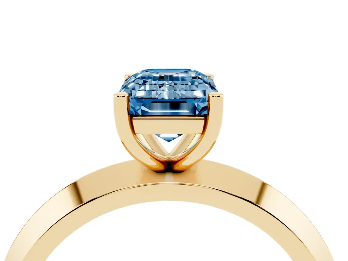 Fancy Blue Emerald Cut Cut Solitaire Engagement Ring with Flat Band and Four-Prong Setting Yellow gold