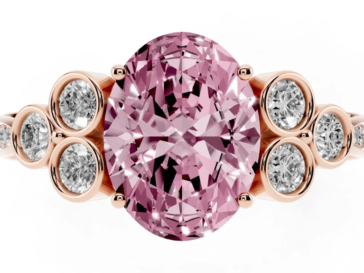 Fancy Pink Oval Cut Cut Diamond Engagement Ring with Bezel Set Round Side Stones and Prong Setting Rose gold