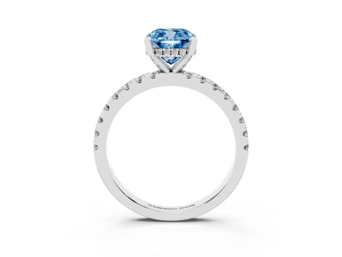 Fancy Blue Cushion Cut Diamond Solitaire Ring with Round Pavé Band and Four-Prong Setting Silver