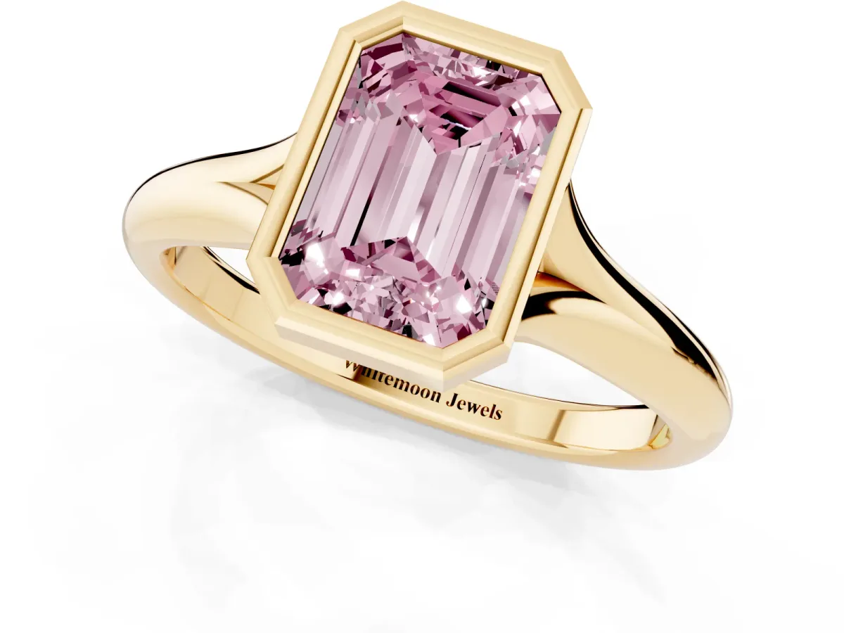 Fancy Pink Bezel Set Emerald Cut Solitaire Diamond Ring with Smooth Band Yellow gold