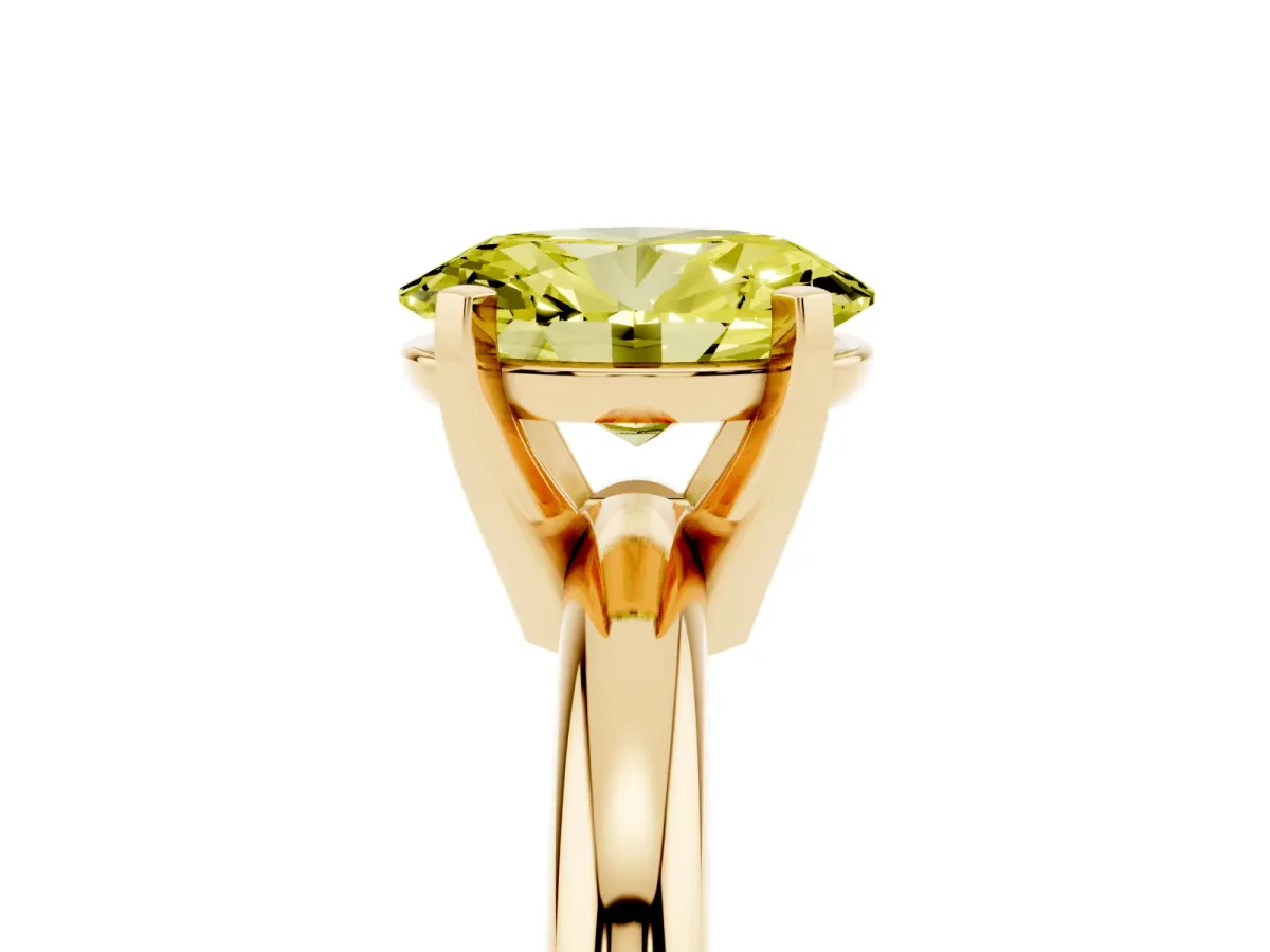 Fancy Yellow Oval Cut Diamond Solitaire Engagement Ring with Round Band and Four-Prong Setting Yellow gold