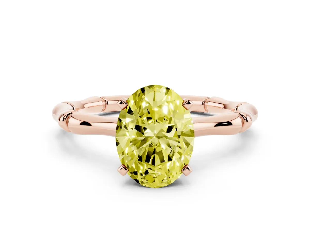 Fancy Yellow Oval Cut Solitaire Diamond Ring with Bamboo Band and Four-Prong Setting Rose gold