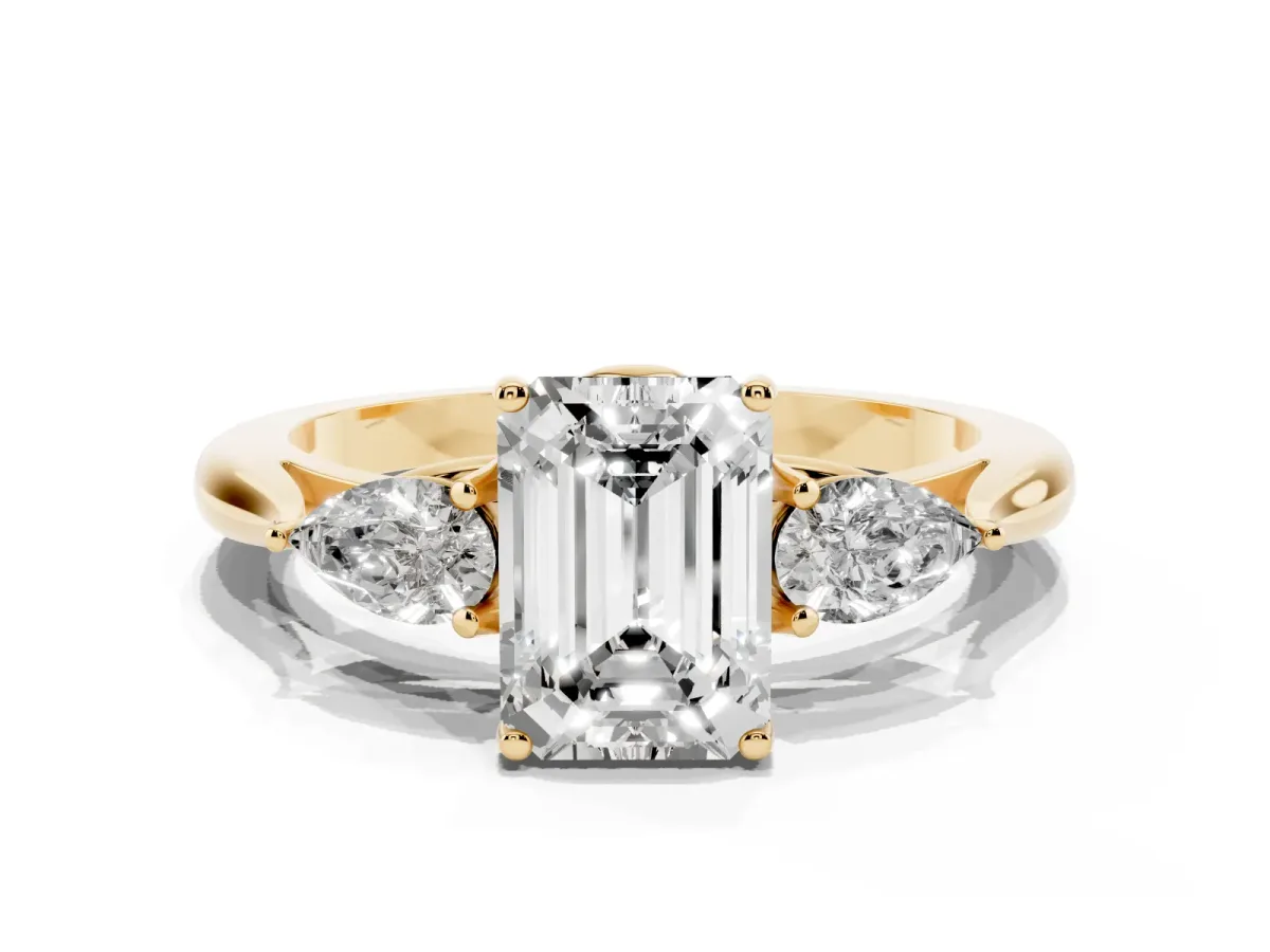Emerald Cut Diamond Three-Stone Ring with Pear Side Stones and Prong Setting Yellow gold