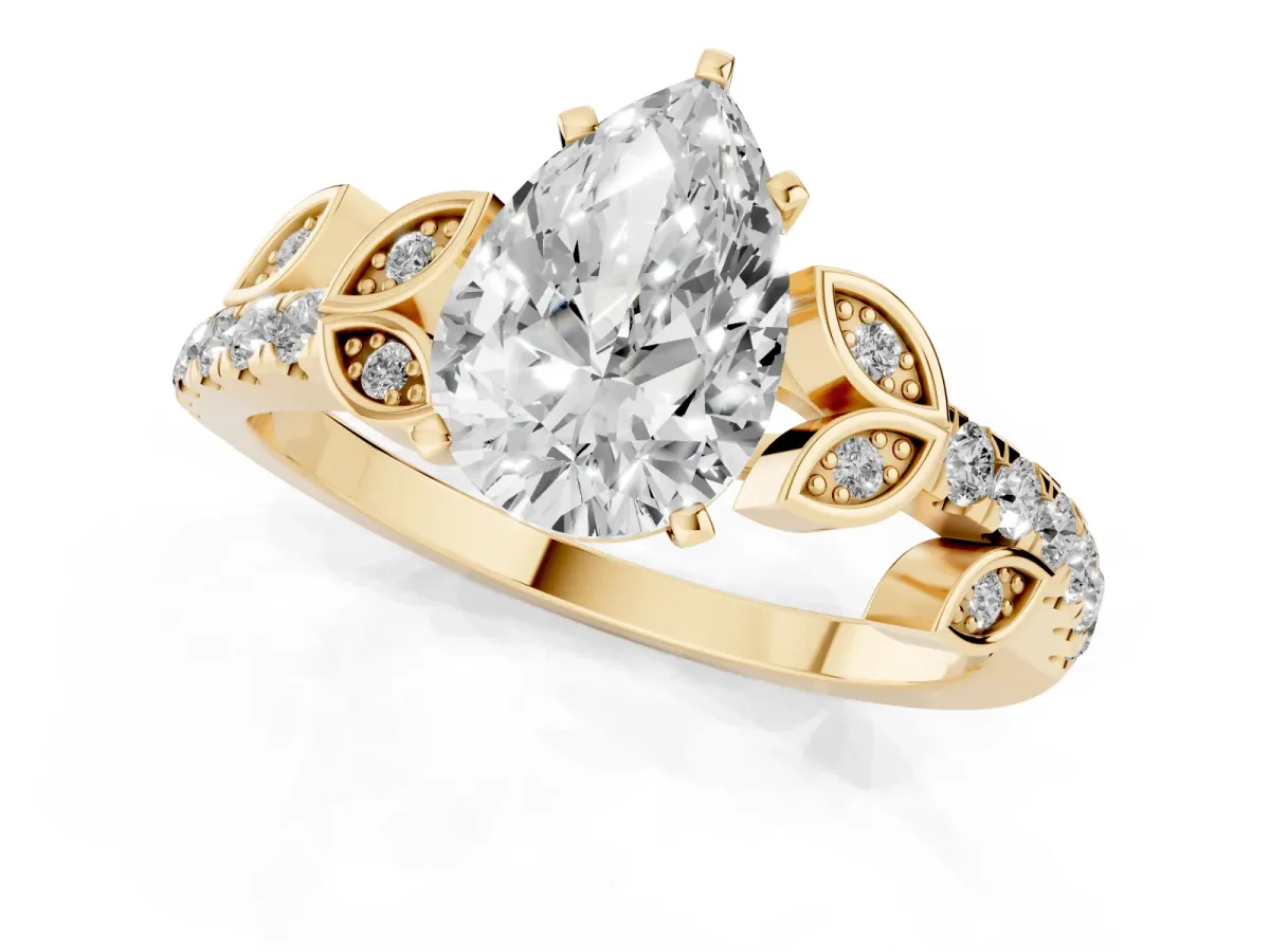 Pear Cut Solitaire Leaf-Inspired Diamond Ring with Pavé Band and Four-Prong Setting Yellow gold