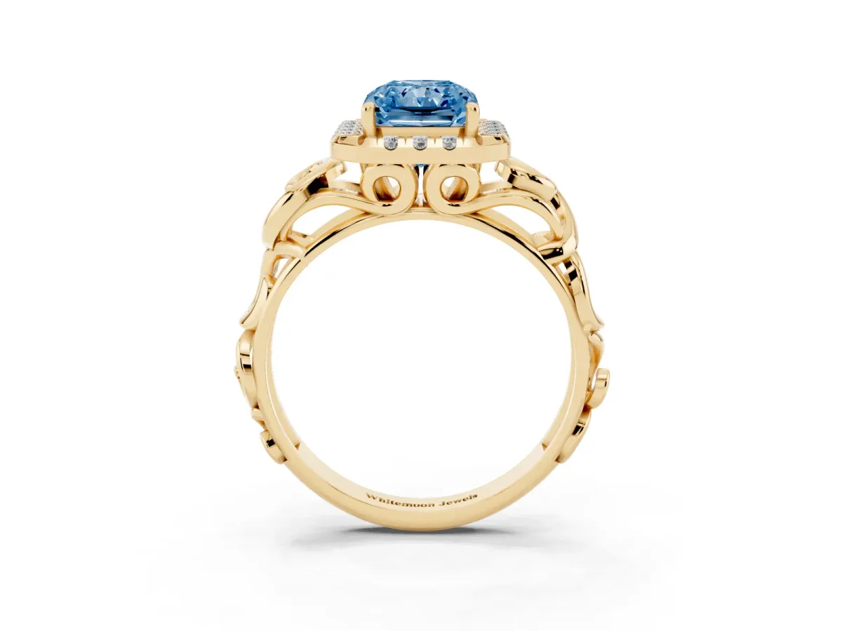 Fancy Blue Radiant Cut Cut Halo Diamond Ring with Scrollwork Band and Four-Prong Setting Yellow gold