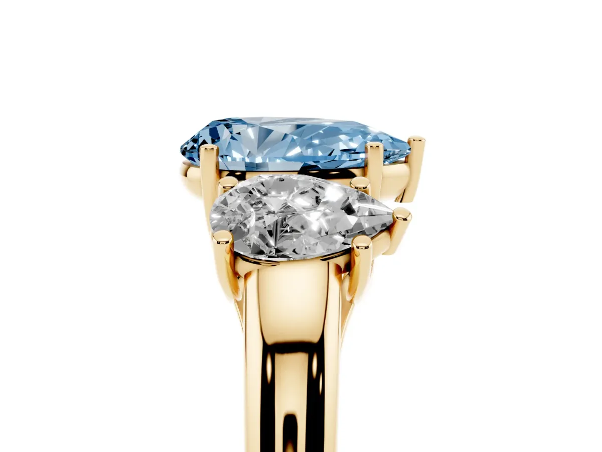 Fancy Blue Three-Stone Pear Cut Diamond Engagement Ring with Prong Setting Yellow gold