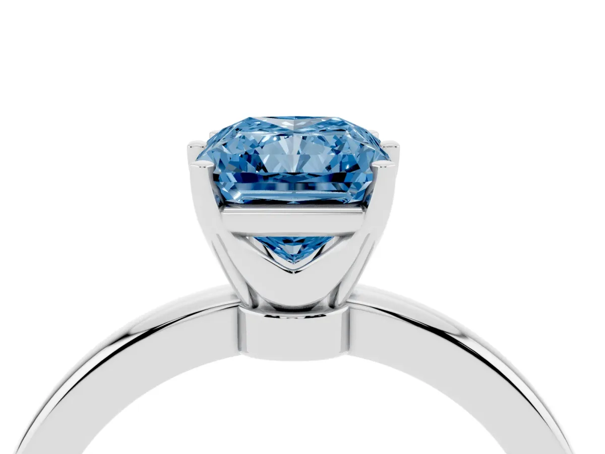 Fancy Blue Radiant Cut Solitaire Diamond Ring with Six-Prong Setting on a Classic Band Silver