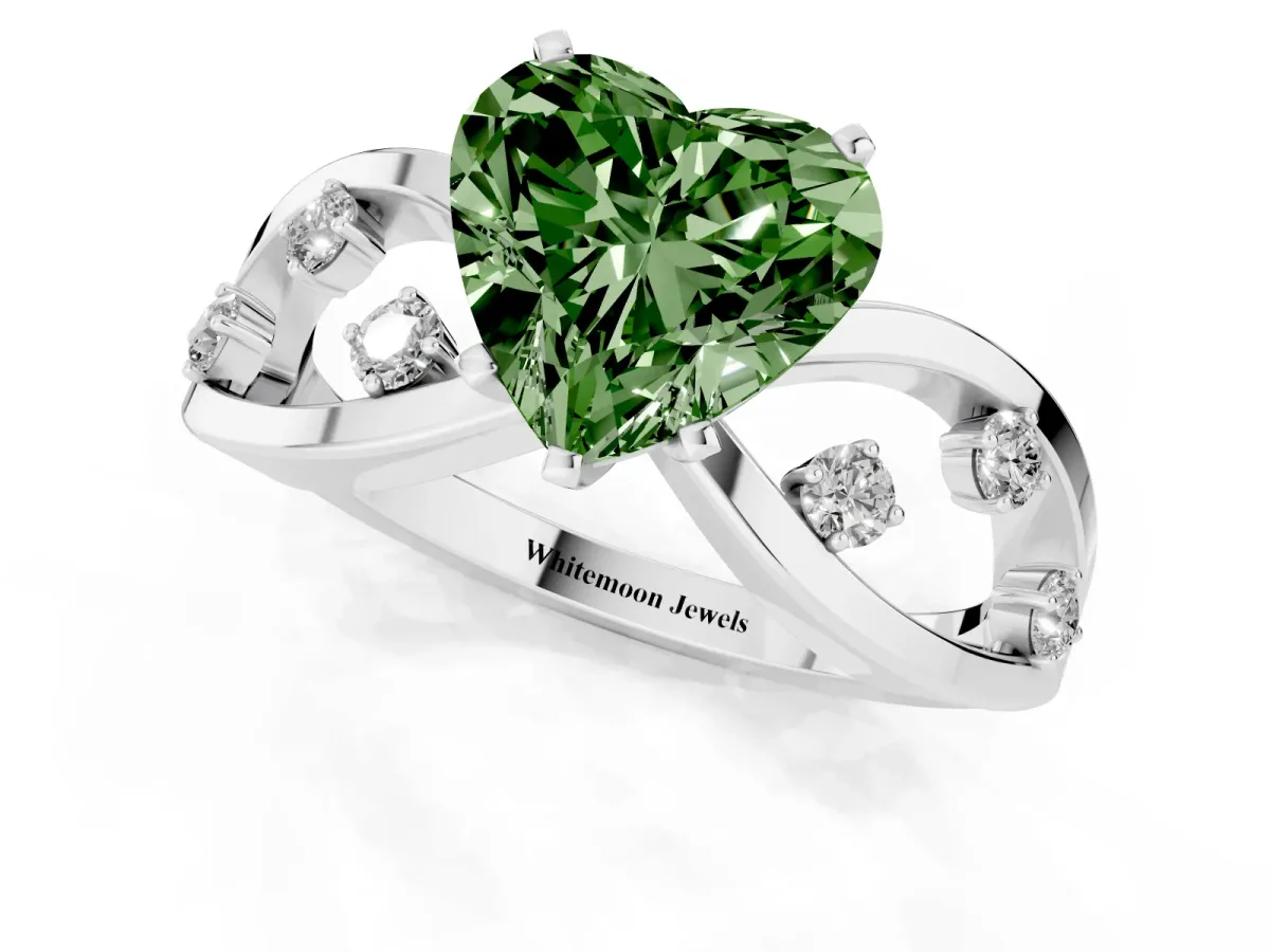 Fancy Green Heart Cut Cut Solitaire Diamond with Side Stones on Criss-Cross Band and Four-Prong Setting Platinum