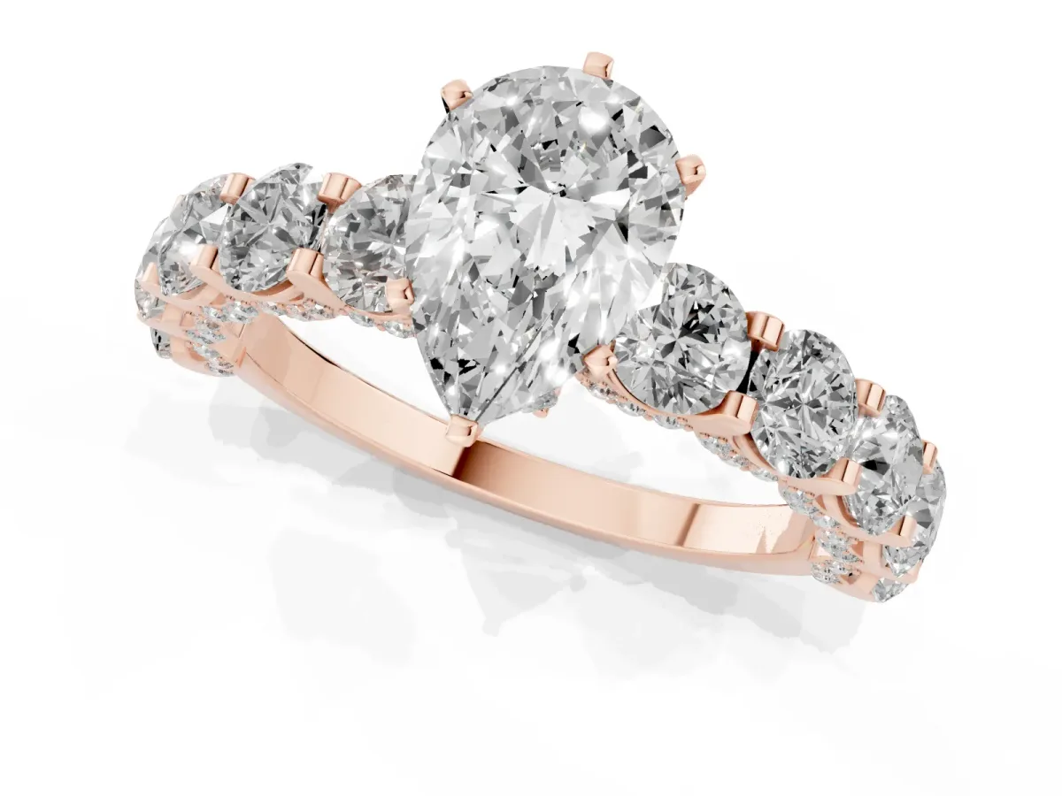 Pear Cut Diamond Side Stone Engagement Ring with Four-Prong Setting Rose gold