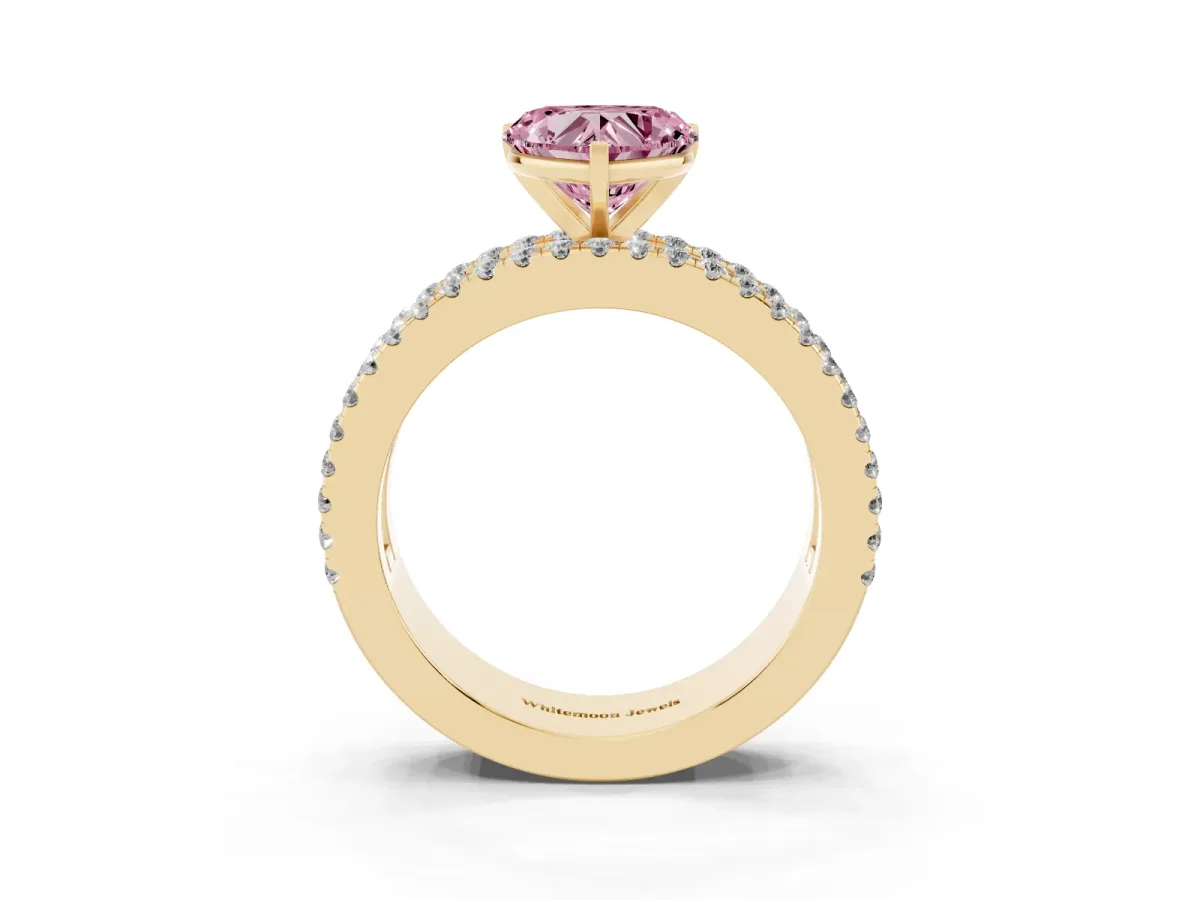 Fancy Pink Heart Cut Diamond Solitaire Ring with Pavé and Channel Set Band Yellow gold