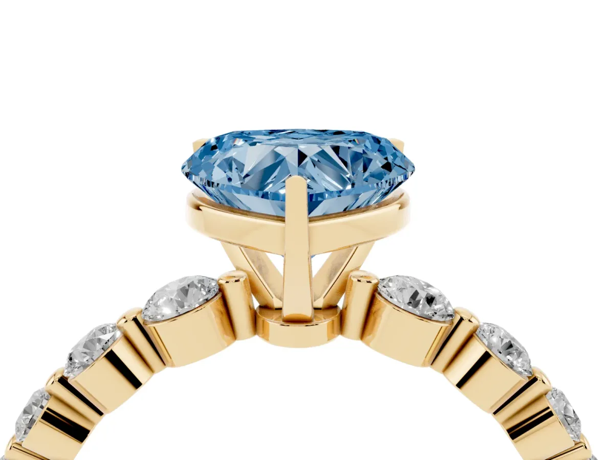 Fancy Blue Heart Cut Solitaire Diamond Ring with Pave Band and Four-Prong Setting Yellow gold