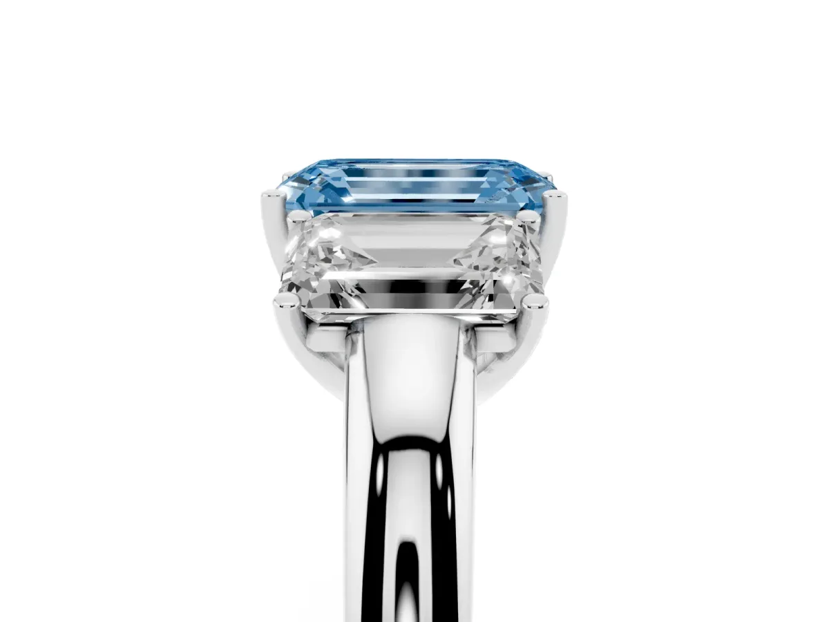 Fancy Blue Emerald Cut Diamond Three-Stone Ring with Four-Prong Setting and Classic Band Platinum