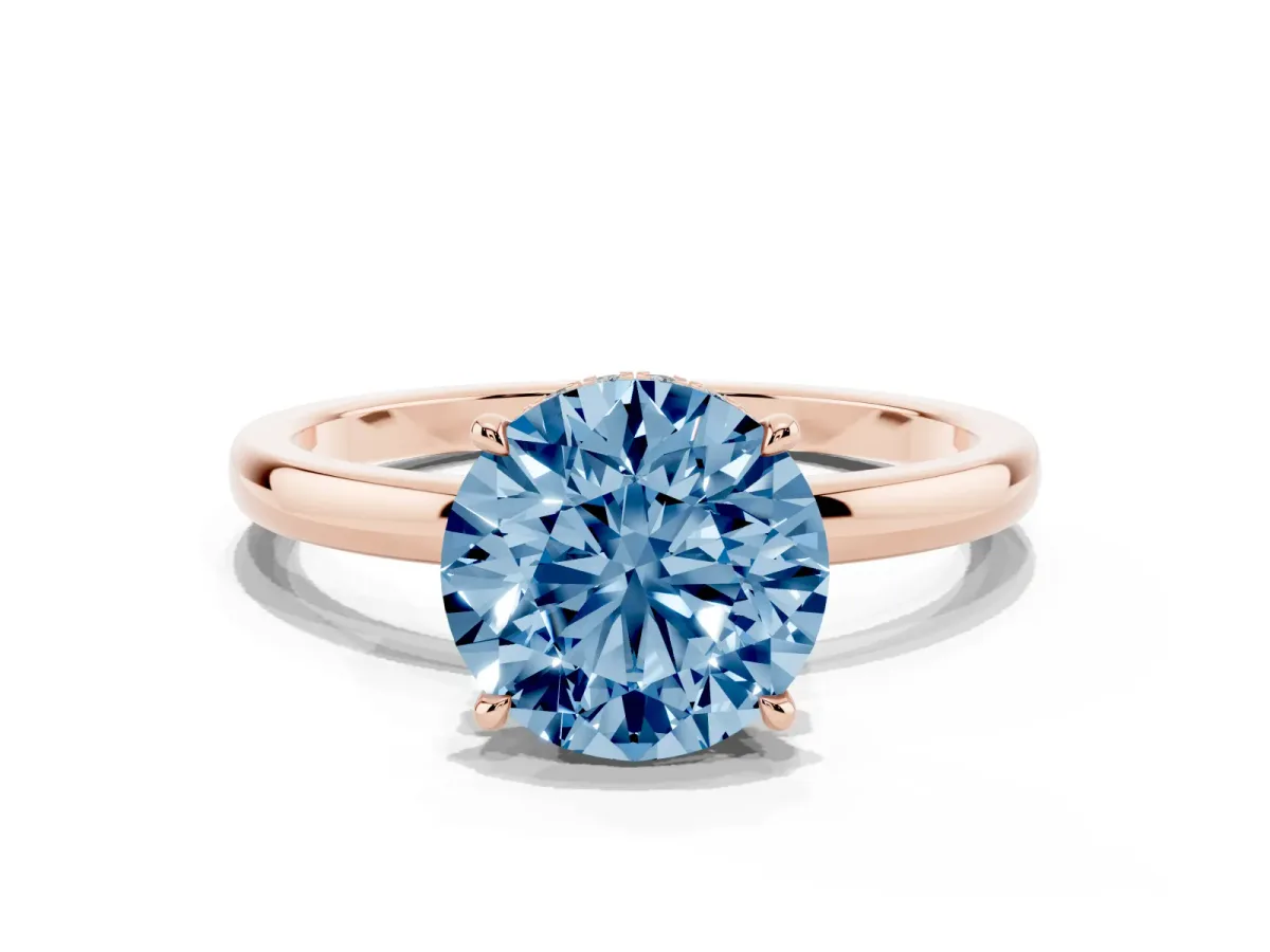 Fancy Blue Round Cut Solitaire Engagement Ring with Cathedral Band and Four-Prong Setting Rose gold