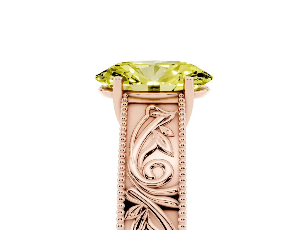 Fancy Yellow Oval Cut Diamond Solitaire Ring with Engraved Band and Four-Prong Setting Rose gold