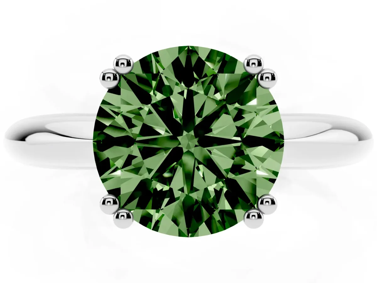 Fancy Green Round Cut Cut Solitaire Engagement Ring with Tapered Band and Four-Prong Setting Silver