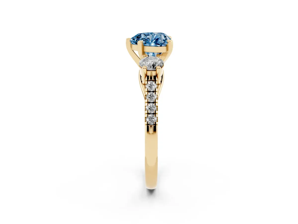 Fancy Blue Three-Stone Heart Cut Diamond Pavé Band with Four-Prong Setting Yellow gold