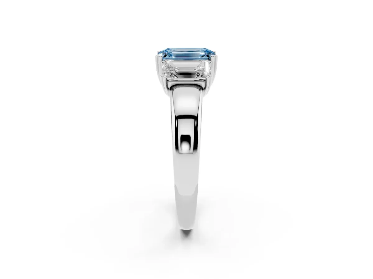 Fancy Blue Three-Stone Emerald Cut Cut Diamond Ring with Channel Set Band and Four-Prong Setting Silver