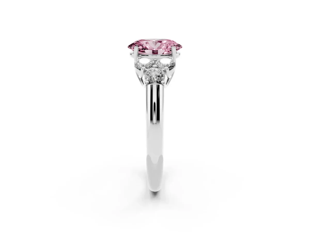 Fancy Pink Oval Cut Cut Diamond Cluster Ring with Round Accent Stones and Prong Setting on a Classic Band Platinum