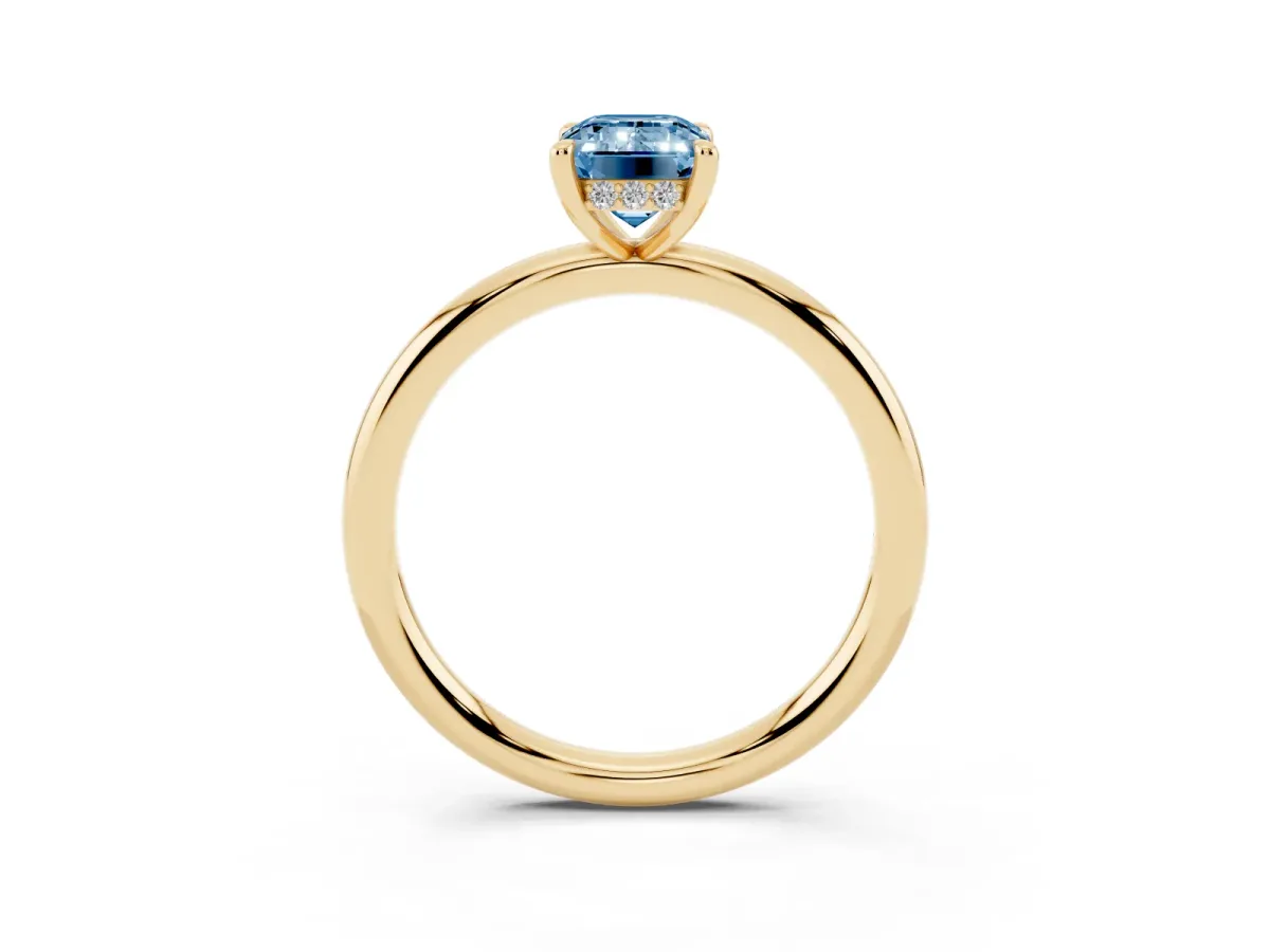 Fancy Blue Emerald Cut Diamond Solitaire Ring with Thin Band and Four-Prong Setting Yellow gold