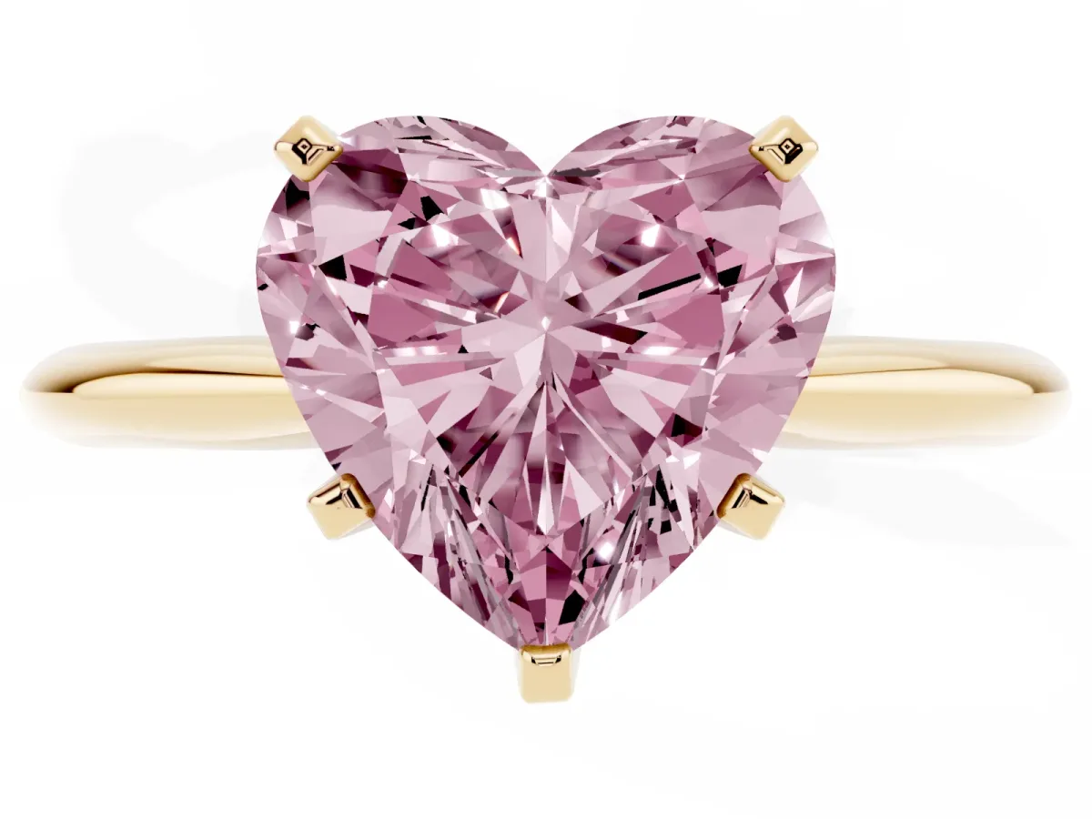 Fancy Pink Heart Cut Cut Solitaire Ring with Four-Prong Setting on a Classic Band Yellow gold