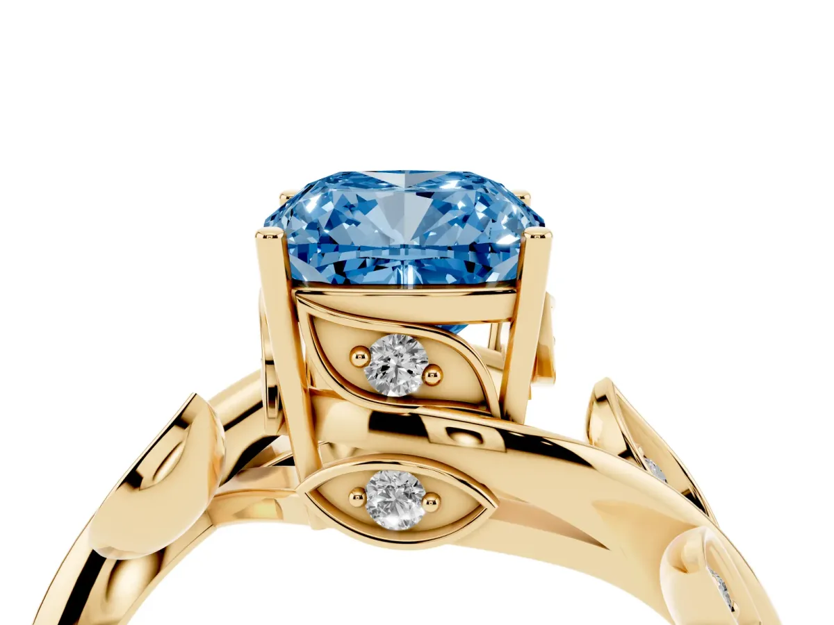 Fancy Blue Cushion Cut Solitaire Twist Engagement Ring with Leaf Accents and Prong Setting Yellow gold