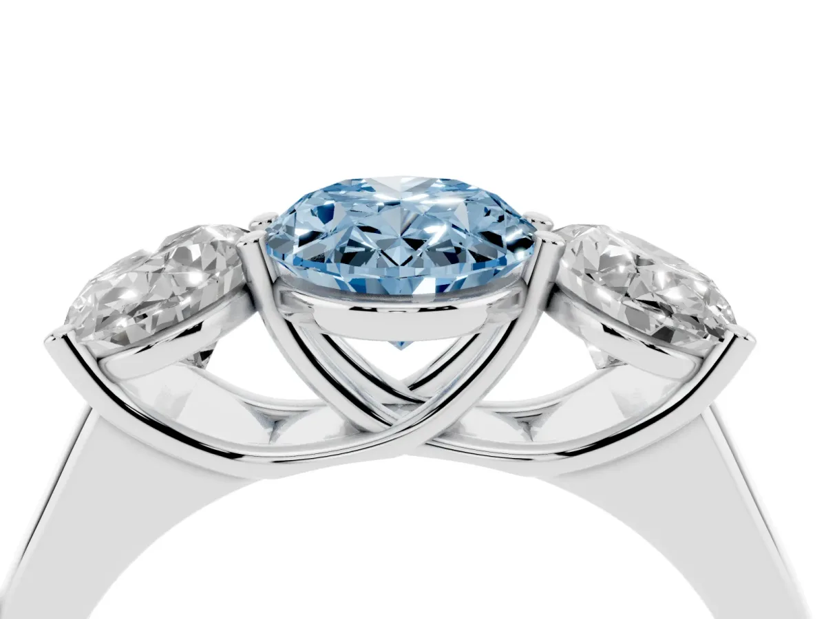 Fancy Blue Oval Cut Three-Stone Diamond Ring with Prong Setting on a Classic Band Platinum