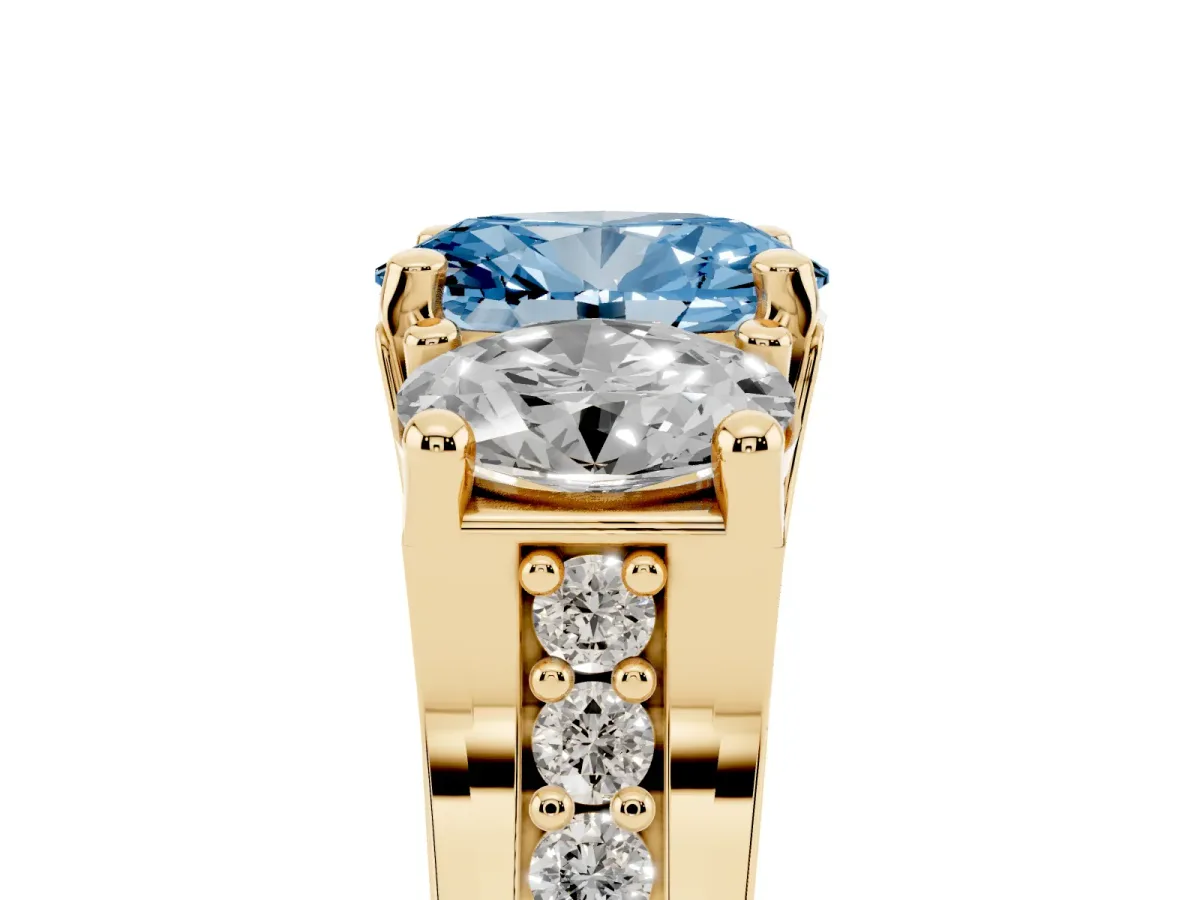 Fancy Blue Oval Cut Diamond Three-Stone Ring with Channel Set Band and Four-Prong Setting Yellow gold